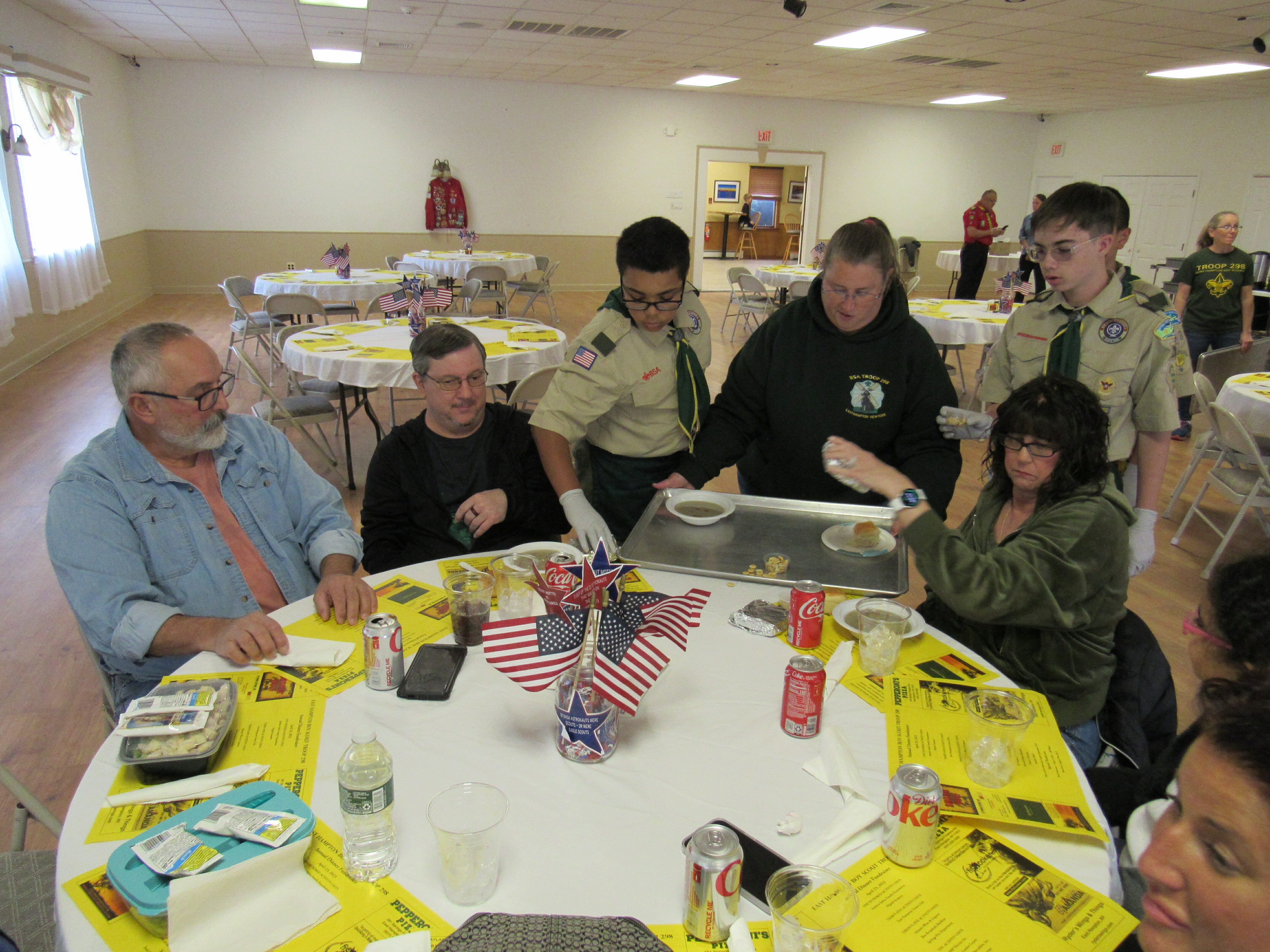 Scouts Elias Morgan, left,  and Eddie Bedell serving a clam chowder meal to a table of hungry supporters at the American  Legion Hall. COURTESY TROOP 298