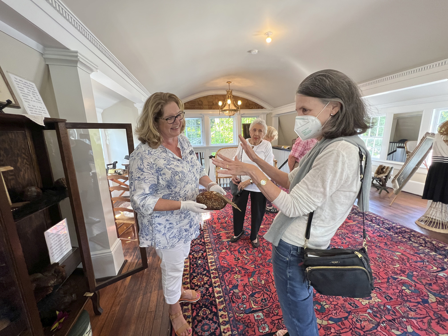 Rosemarie King, secretary of the Hampton Bays Historical Society, gives a tour of the Lyzon Hat Shop in 2022.  DANA SHAW