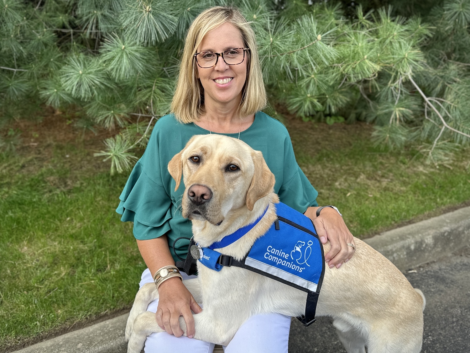 Kate Swezey, a social worker in Westhampton Beach Middle School, with Oric, a dog came to her through the organization Canine Companions, and will serve as a facility dog.