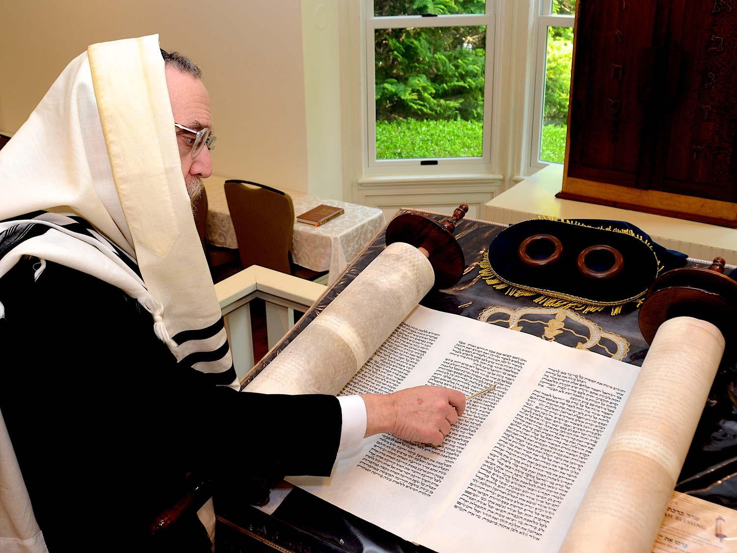 Chabad of the Hamptons Rabbi Leibel Baumgarten reads from the Torah. KYRIL BROMLEY