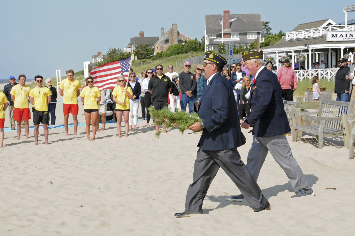 American Legion Post 419 Commander Jeff Kiger and Everit Albert Herter VFW Post 550 Commander Bill Mott take a wreath to the sea at the “Lost at Sea” Memorial Day service at Main Beach in East Hampton on Monday morning.  RICHARD LEWIN
