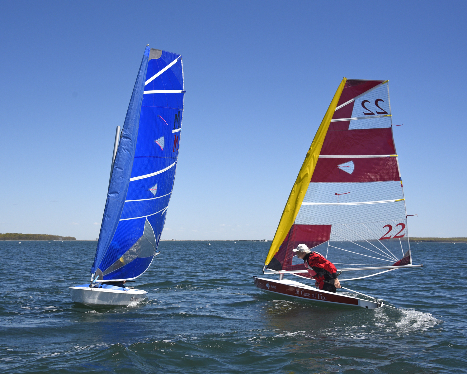 Marty Knab abd Scott Sandell in a tacking duel on their way to the weather mark in the final race.   MICHAEL MELLA