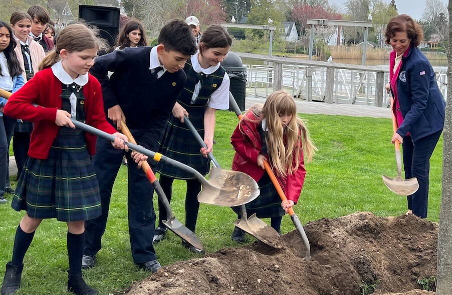 Our Lady of the Hamptons School intermediate students help with a tree planting on Arbor Day. COURTESY OUR LADY OF THE HAMPTONS SCHOOL