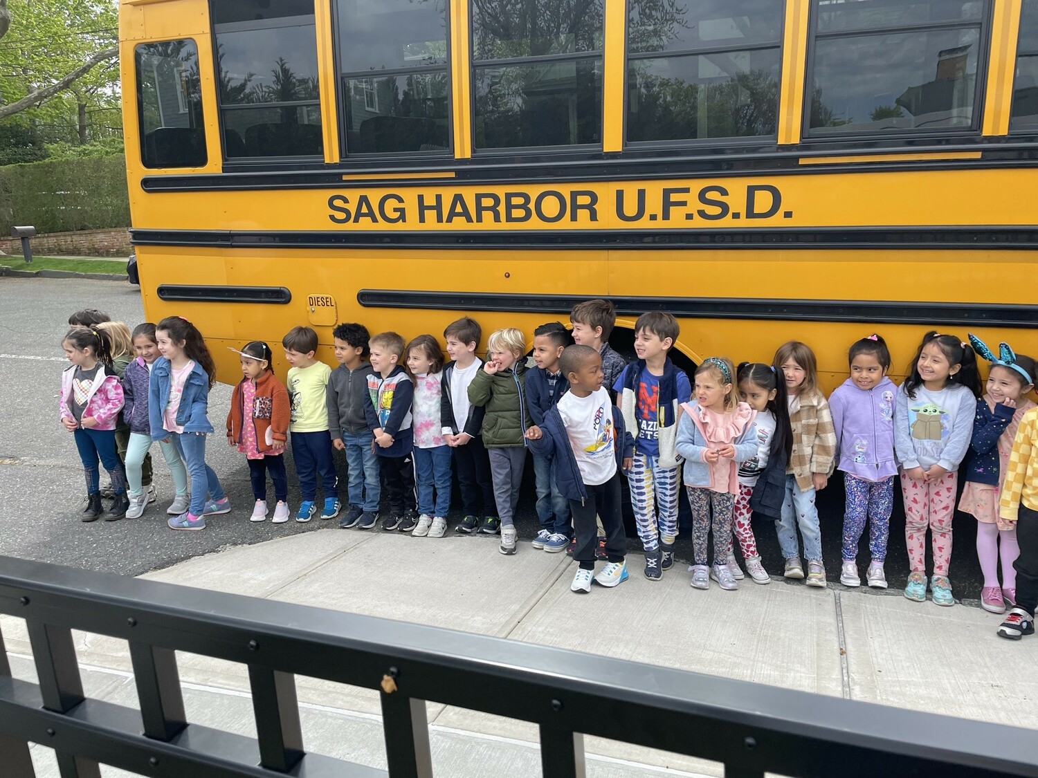 Sag Harbor School District bus driver Donna Skrezec recently visited the pre-K class at Sag Harbor Learning Center to talk about bus safety. With Skrezec’s help, the students learned how to buckle their seatbelts, the importance of remaining in their seats while the bus is in motion and where to locate the eight emergency exits. “The students even practiced jumping off the back of the bus in case of an emergency and used the bus phone to call the dispatcher,” said teacher Kara Romeo. COURTESY SAG HARBOR SCHOOL DISTRICT
