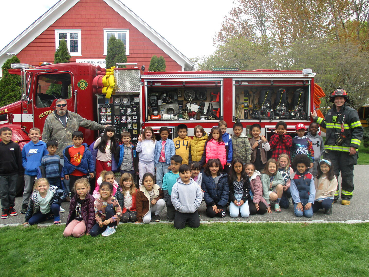 Students from Wainscott School visited the Sagaponack School on Friday so that all could learn from the firefighters from the Sag Harbor Fire Department, which brought a truck over to the school for the lesson. The fire safety lesson was presented by Captain Bayard Fenwick of the department's Murray Hill Hose Company 4 squad. COURTESY SAGAPONACK SCHOOL