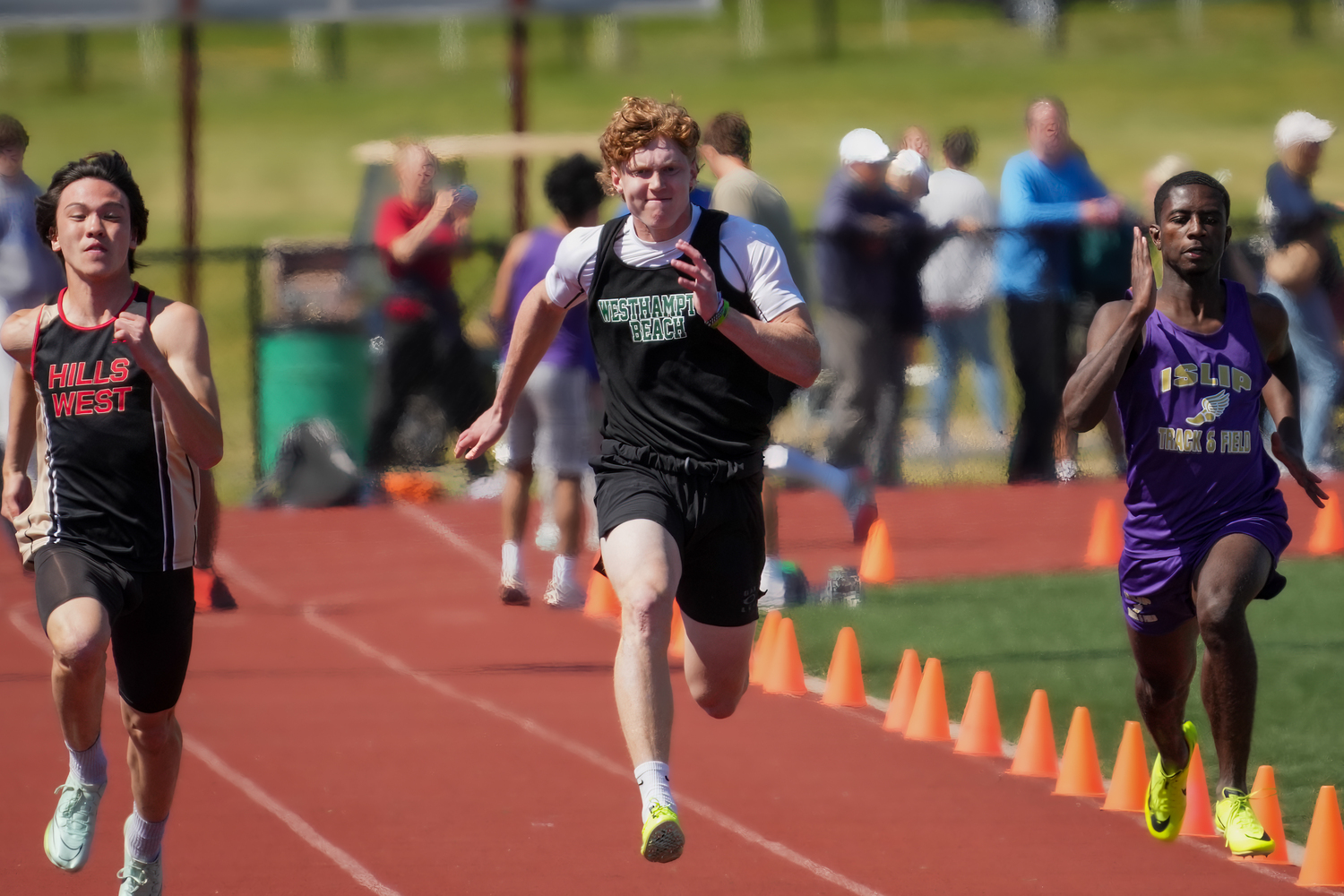 Westhampton Beach junior T.J. Hill competing in the 100-meter dash.   RON ESPOSITO
