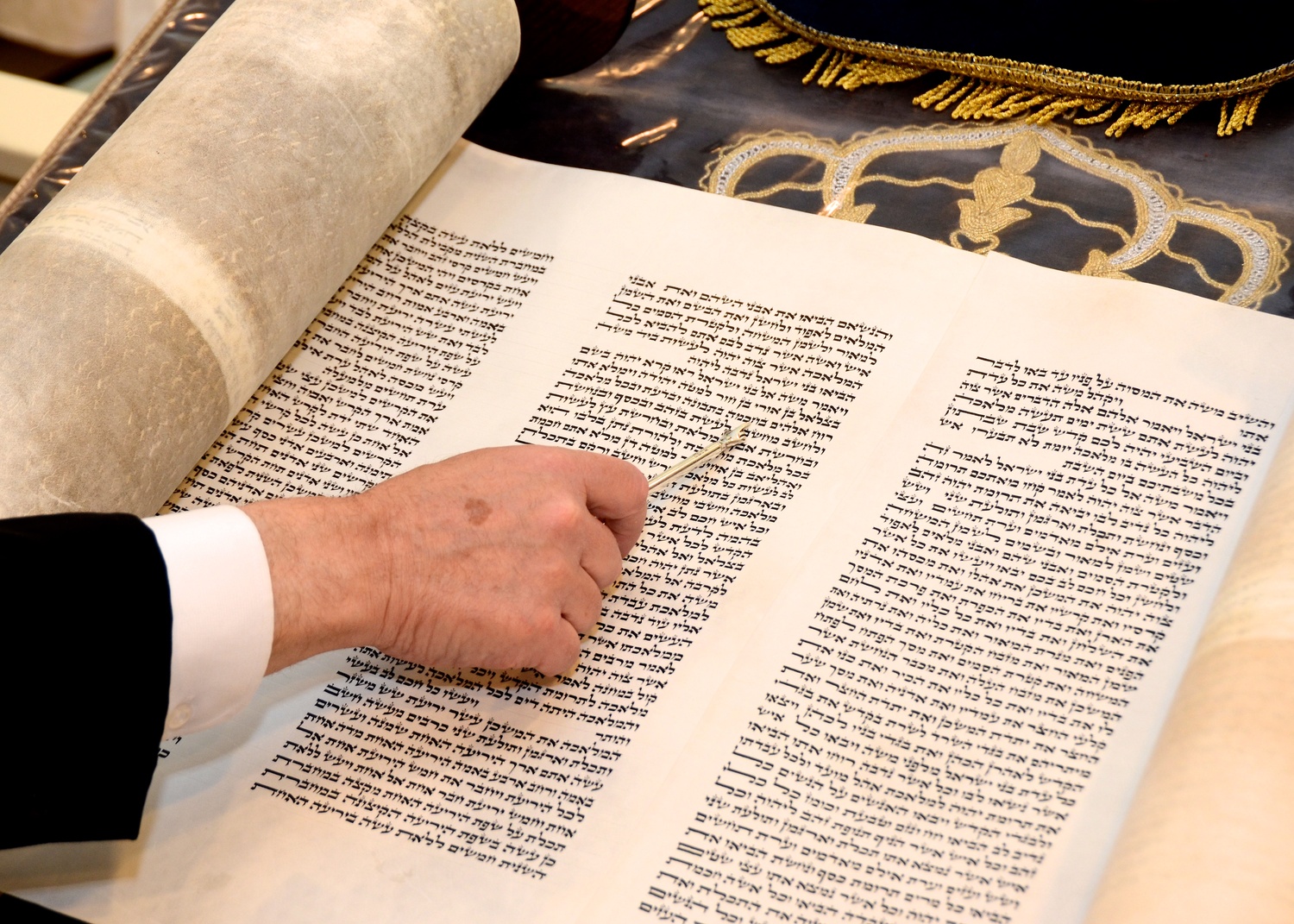 Using a yad, Chabad of the Hamptons Rabbi Leibel Baumgarten reads from the Torah. KYRIL BROMLEY