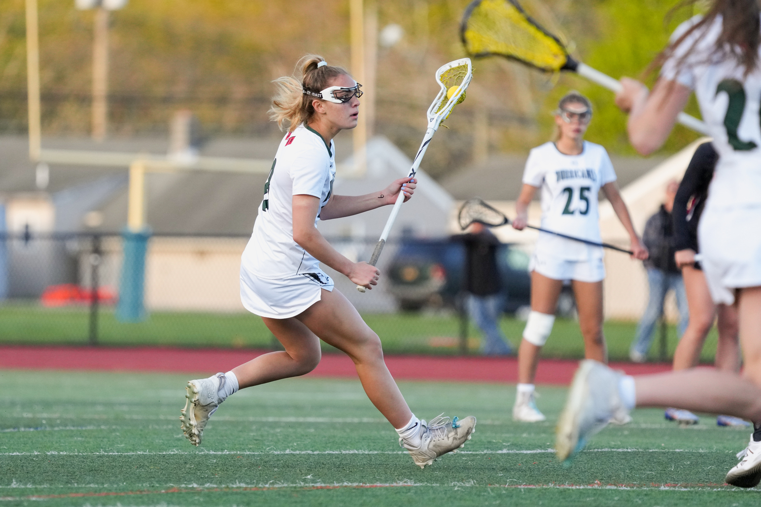 Freshman attack and midfielder Ava Derby looks to for an open teammate cutting in front of the cage. RON ESPOSITO