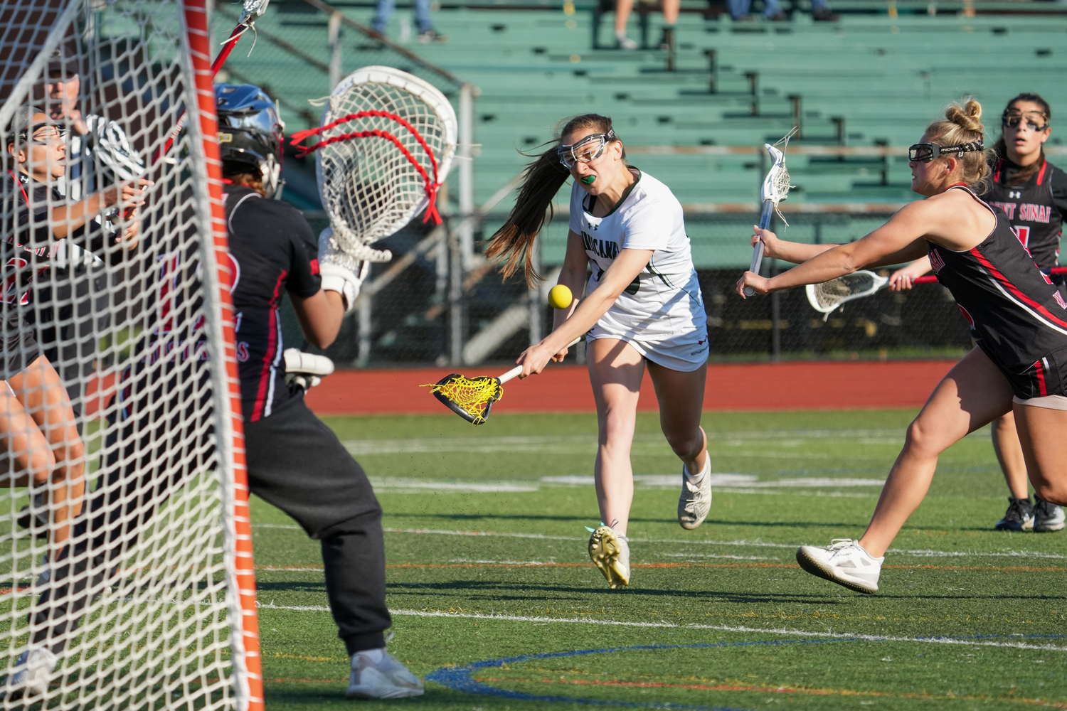 Sophomore attack and midfielder Joely Schaumloffel rockets a shot toward the cage. RON ESPOSITO