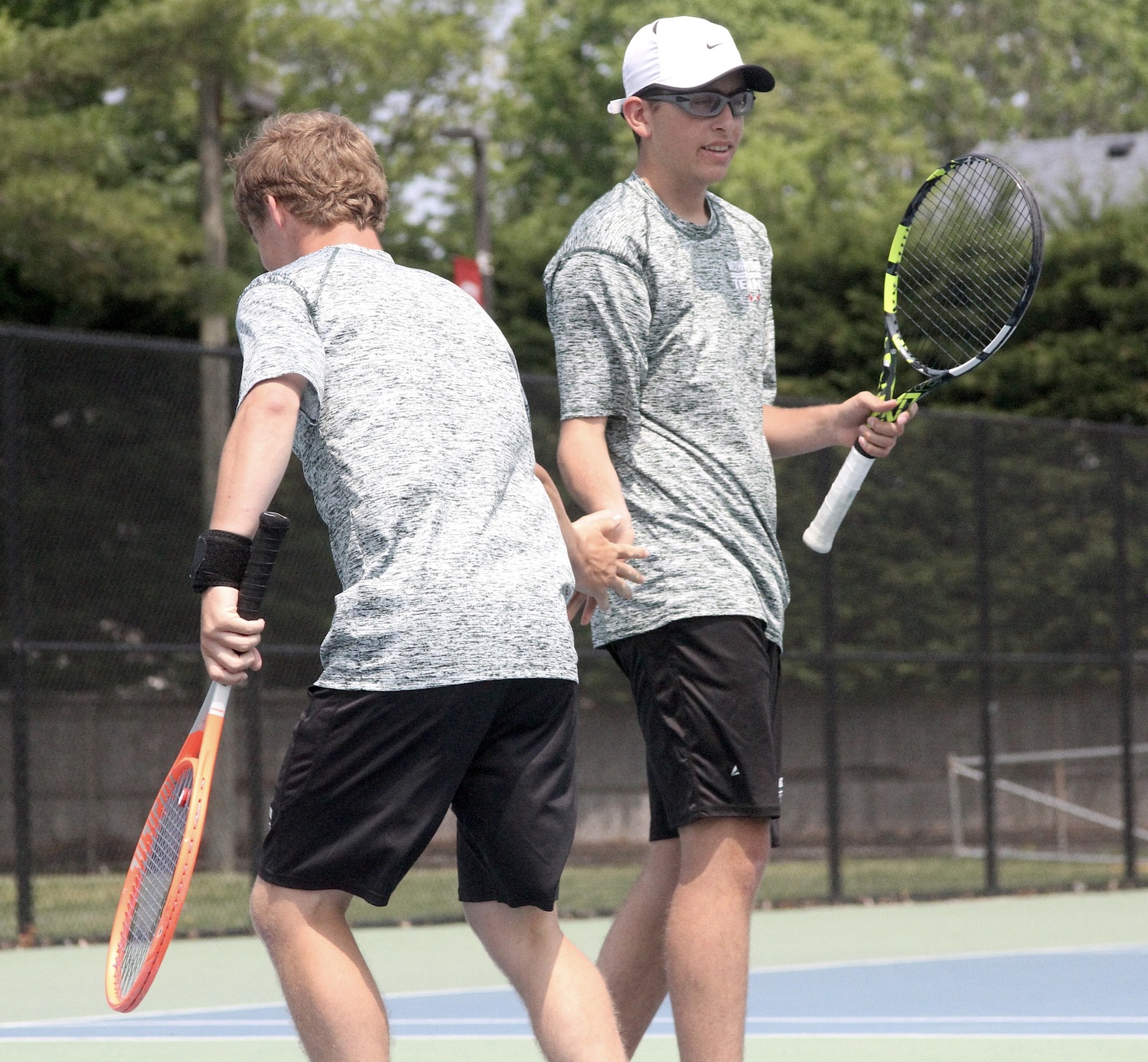 Westhampton Beach sophomore Giancarlo Volpe celebre a point with doubles partner Bobby Stabile. DESIRÉE KEEGAN