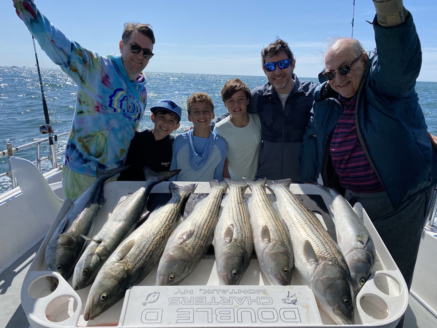 Anglers like the Eisner family, pictured while fishing off Montauk aboard the Double D charter boat, flock to Montauk's for-hire fleet to load up on striped bass fillets for summer barbecues. But an emergency rules change will go into effect on July 2 that will make it much harder to catch 