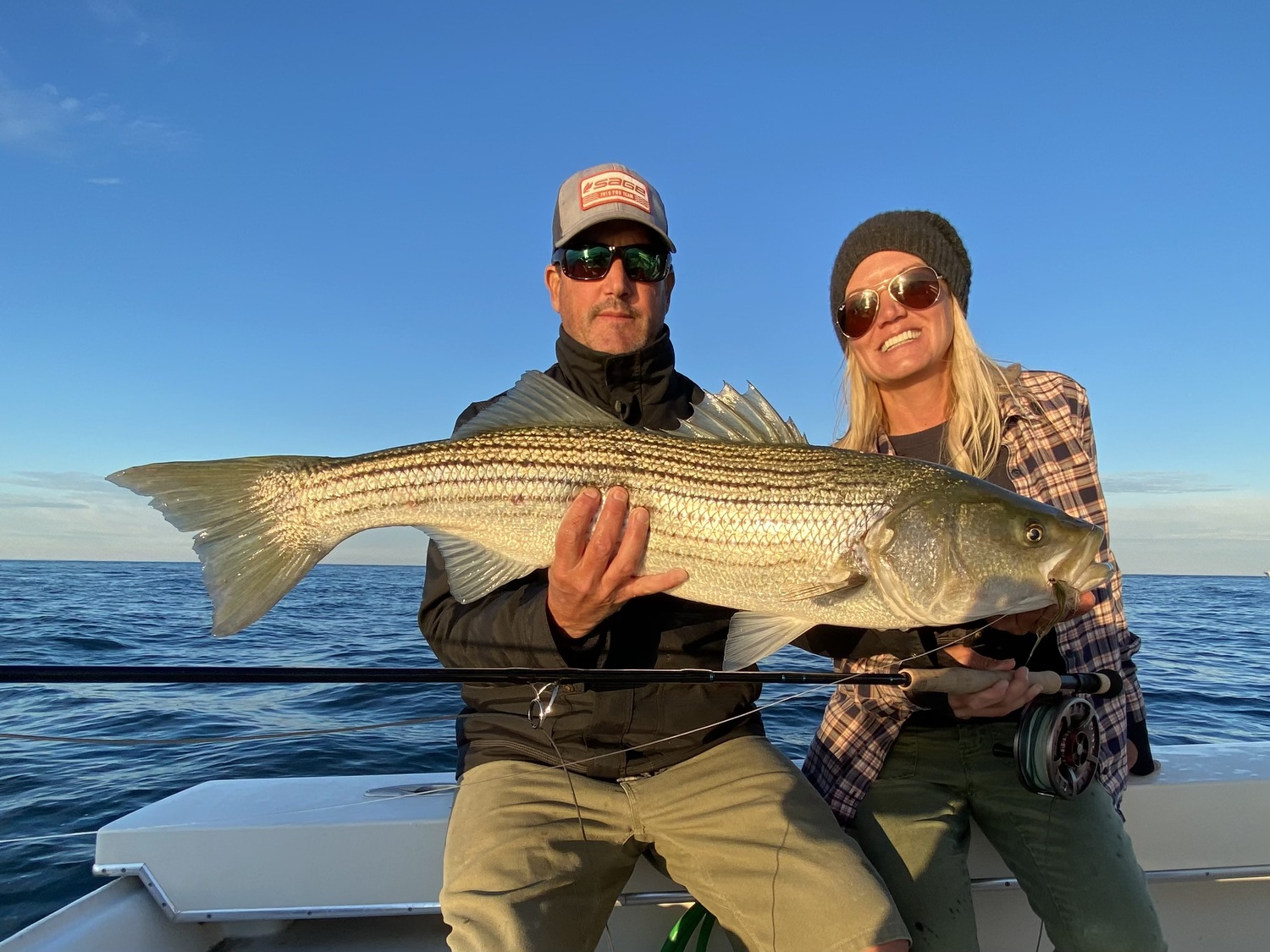 Capt. Tim O'Rourke says that a majority of his customers, like Lea Standahl, are fishing for the thrill of catching striped bass on fly rods or 