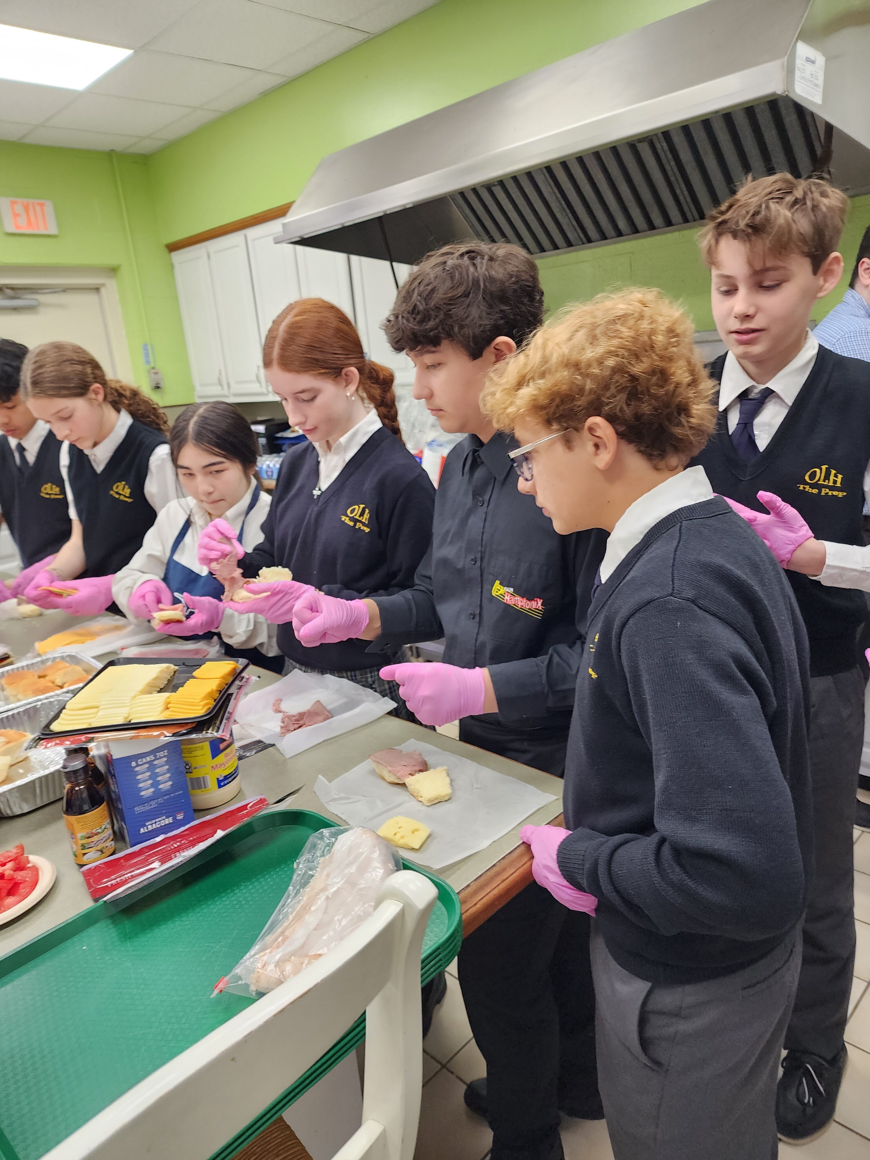 Our Lady of the Hamptons School Prep 8 students made and served the lunch for Senior Citizens Day. COURTESY OUR LADY OF THE HAMPTONS SCHOOL