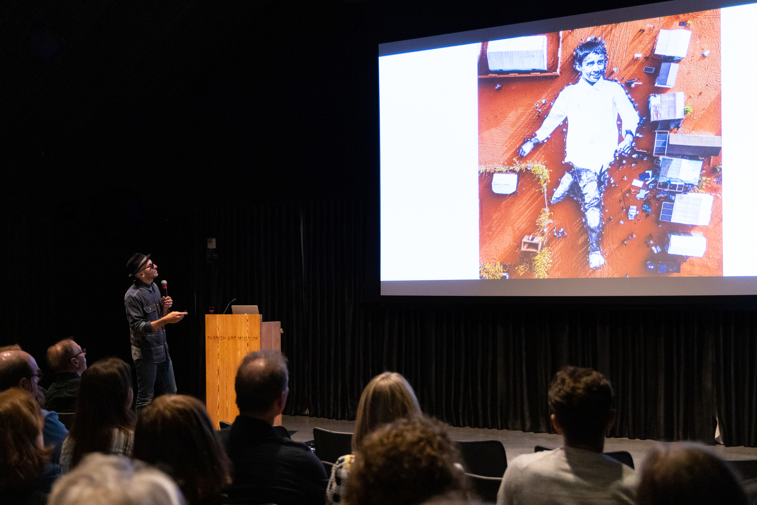 Artist JR discussed his work in a talk at the Parrish Art Museum on June 9. JENNY GORMAN