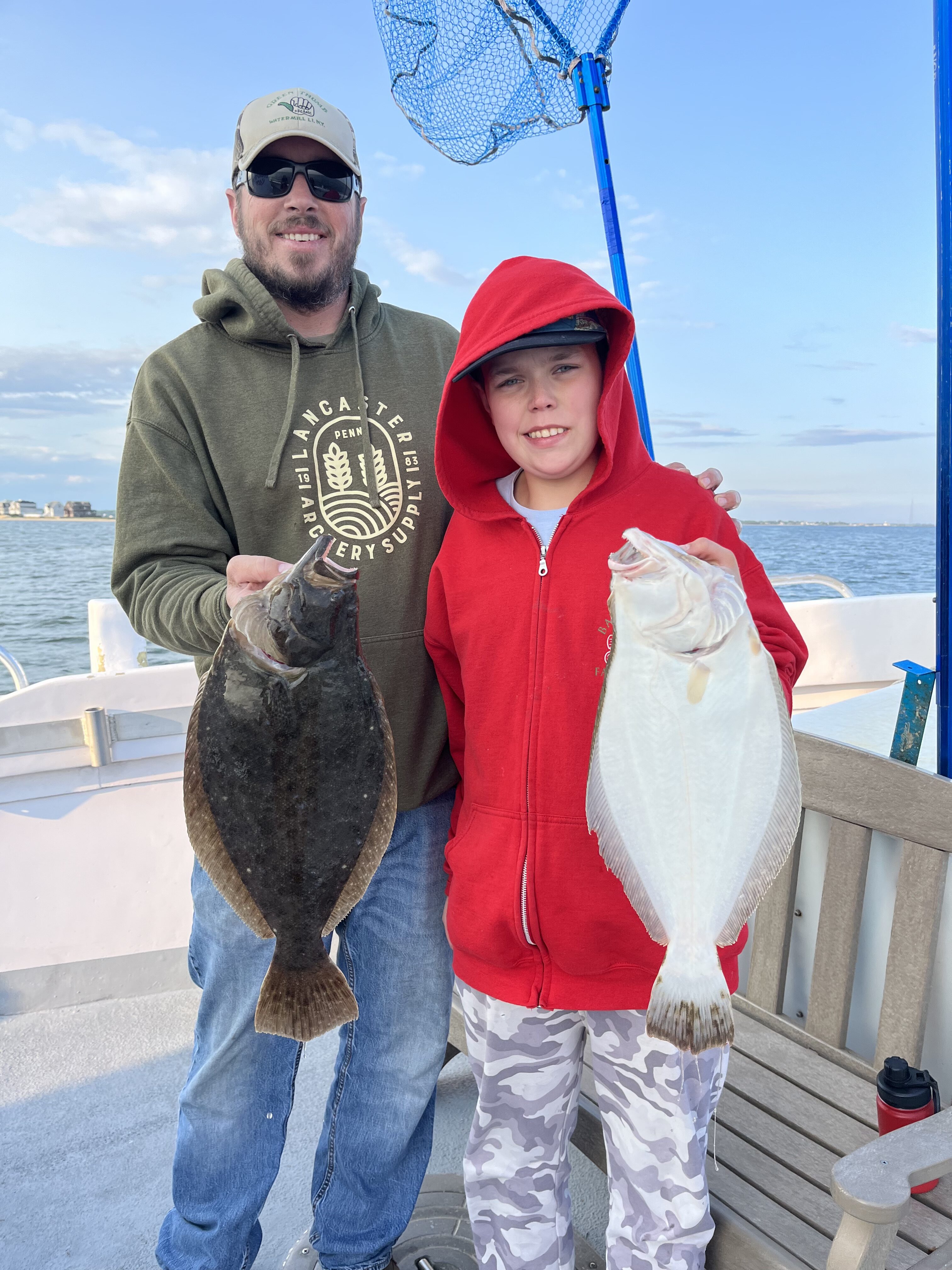 Every day is Father's Day on the fishing grounds. Travis and Zach Muller decked a pair of nice fluke together aboard the Hampton Lady recently. 
Capt. James Foley