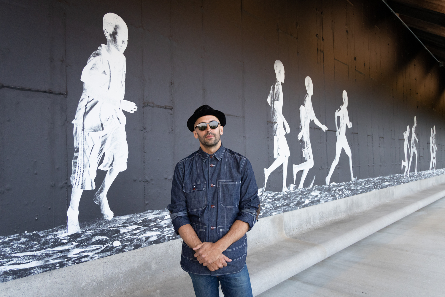 Artist JR with his mural 