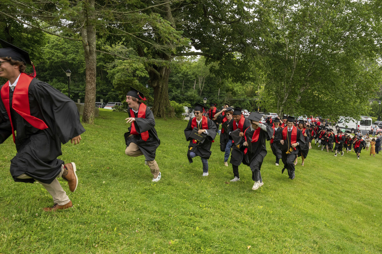 Pierson graduates run up Pierson Hill after graduating.  RON ESPOSITO