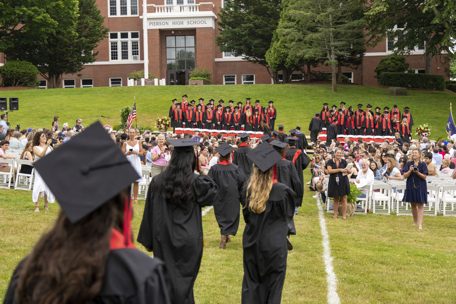 Pierson graduates make their way to their seats on Saturday evening.  RON ESPOSITO