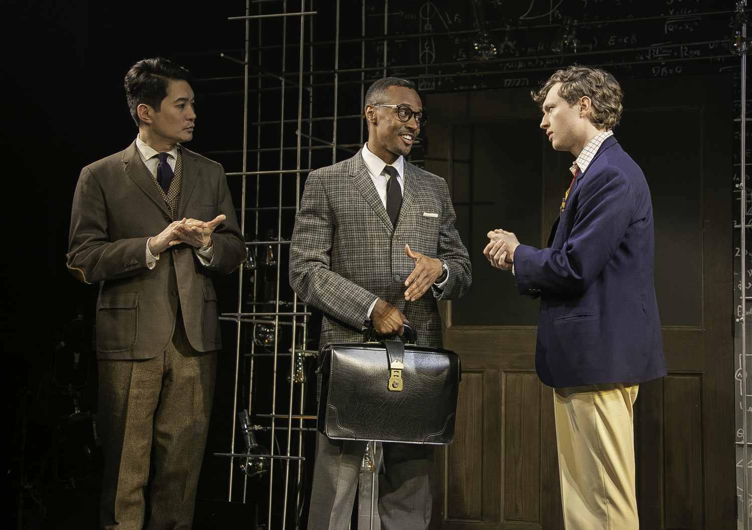 From left, Austin Ku as Francis Crick, Anthony Chatmon II as Maurice Wilkins and Max Chlumecky as James Watson in 