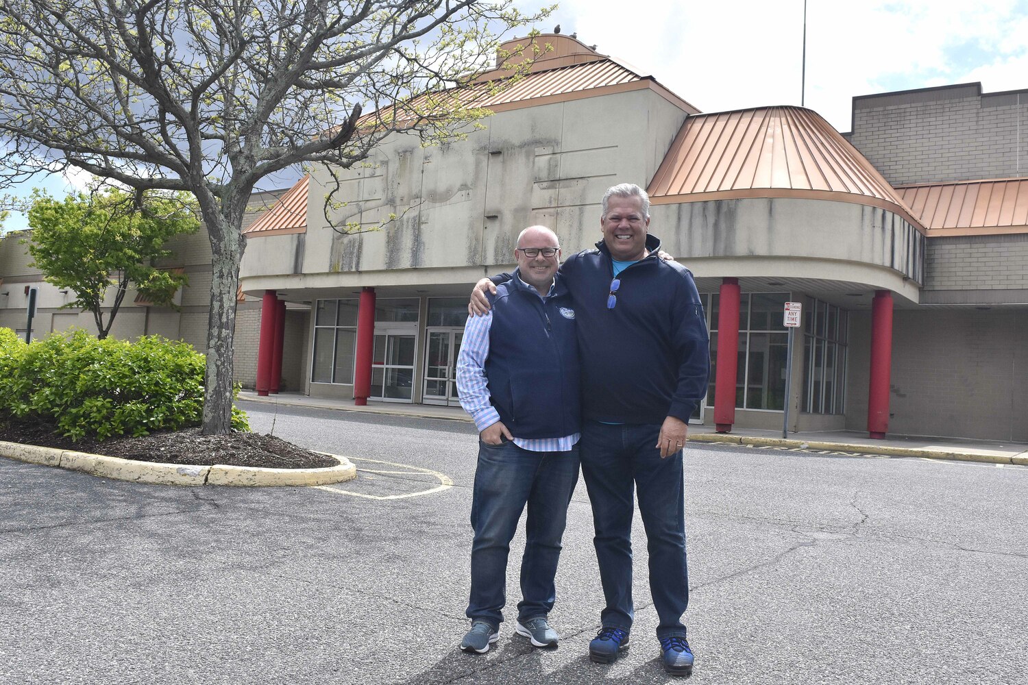 Peter Bachmore and Scott Green at the site in Riverhead where Peconic Pickleball will open.  DREW BUDD