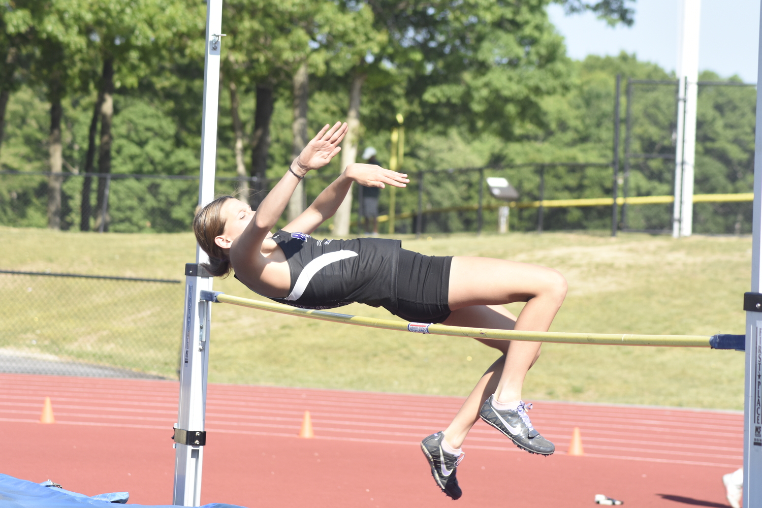 Hampton Bays junior Allie O'Brien in the high jump of the pentathlon.   DREW BUDD