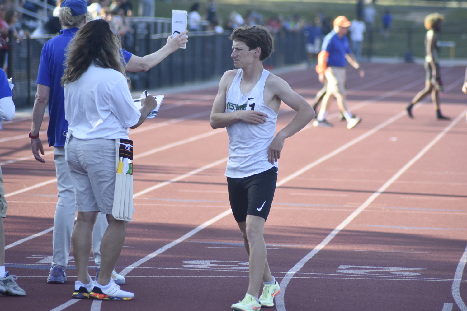 Westhampton Beach senior Max Haynia bows out of the 3,200-meter race due to an injury.   DREW BUDD