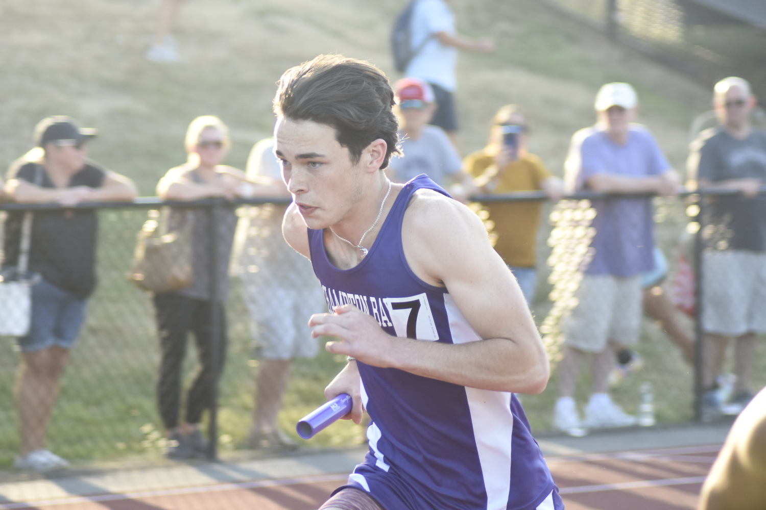 Hampton Bays senior Liam Sutton running in the 4x400-meter relay.   DREW BUDD