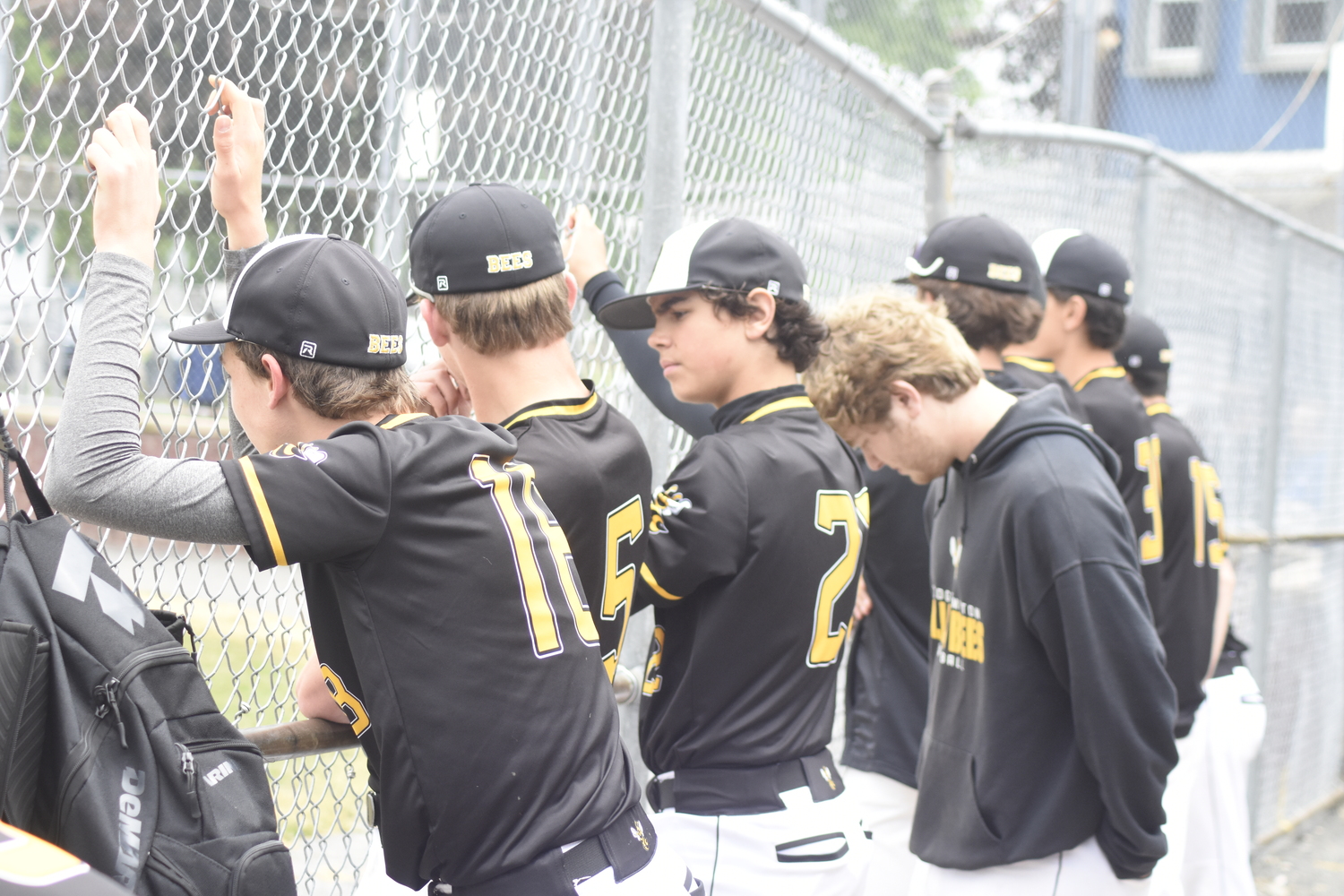 The Killer Bees try to cheer on their teammates in the final inning.   DREW BUDD