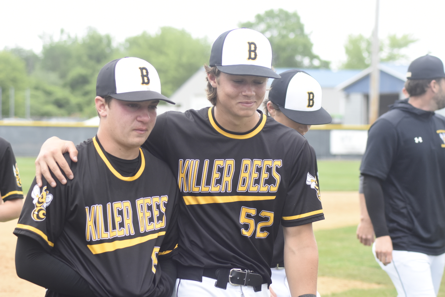 Ross junior Milo Tompkins consoles Bridgehampton senior Scott Vinski after the Bees' 2-0 loss to Chapel Field on Saturday.   DREW BUDD