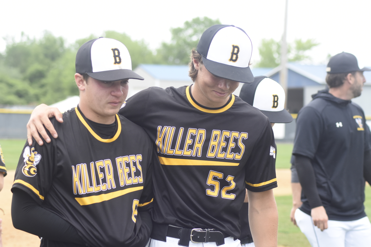 Ross junior Milo Tompkins consoles Bridgehampton senior Scott Vinski after the Bees' 2-0 loss to Chapel Field on Saturday.   DREW BUDD