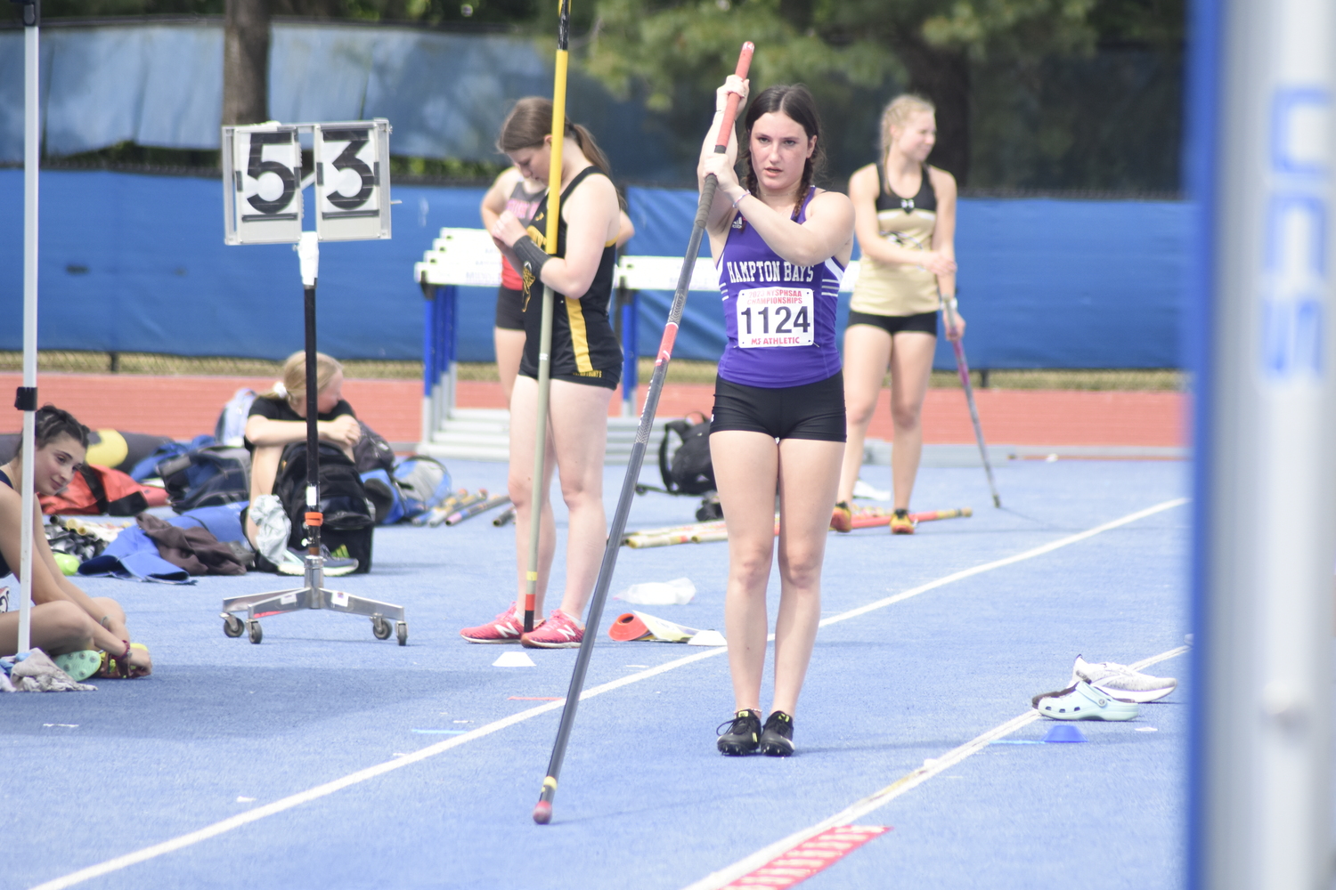 Maizie Poulakis about to start her approach in the pole vault.   DREW BUDD