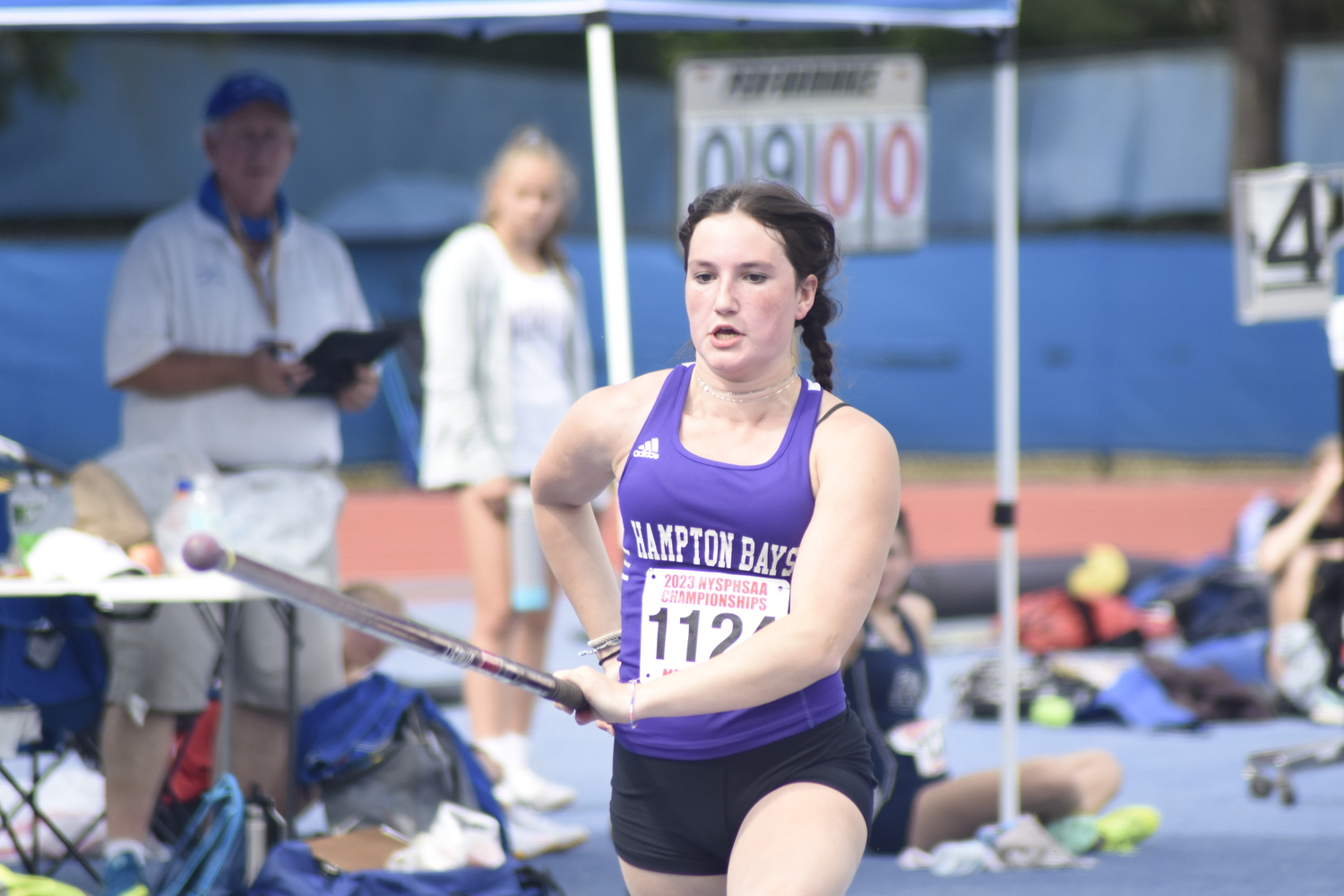 Maizie Poulakis starting her approach in the pole vault.   DREW BUDD