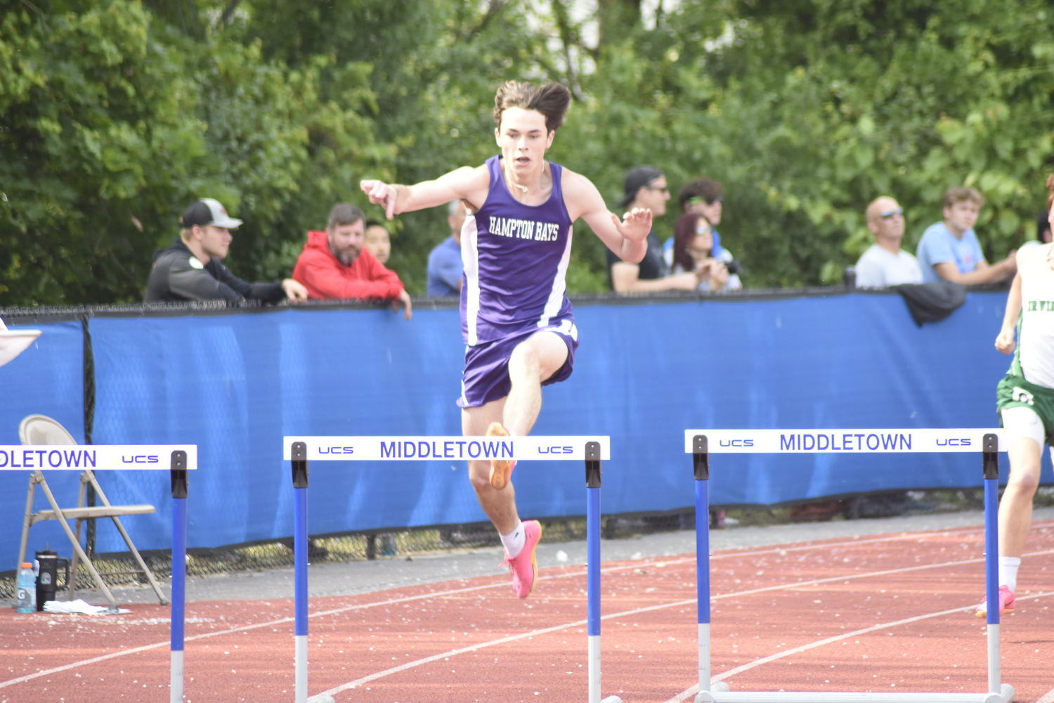 Hampton Bays senior Liam Sutton placed second in his heat, seventh overall in the 400-meter intermediate hurdles on Friday.   DREW BUDD