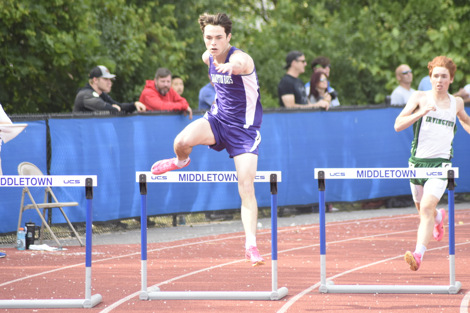 Hampton Bays senior Liam Sutton placed second in his heat, seventh overall in the 400-meter intermediate hurdles on Friday.   DREW BUDD