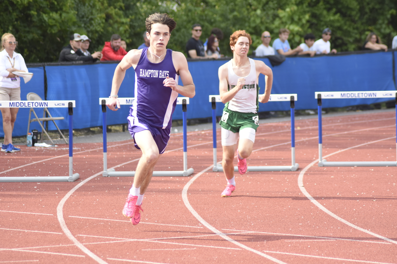 Hampton Bays senior Liam Sutton placed second in his heat, seventh overall in the 400-meter intermediate hurdles on Friday.   DREW BUDD