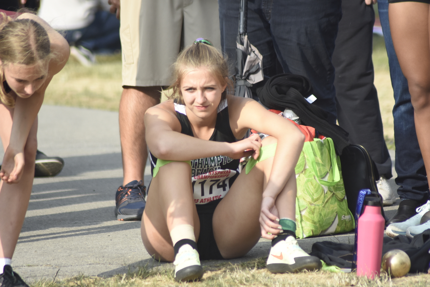 Madison Phillips looks on in the shot put.   DREW BUDD