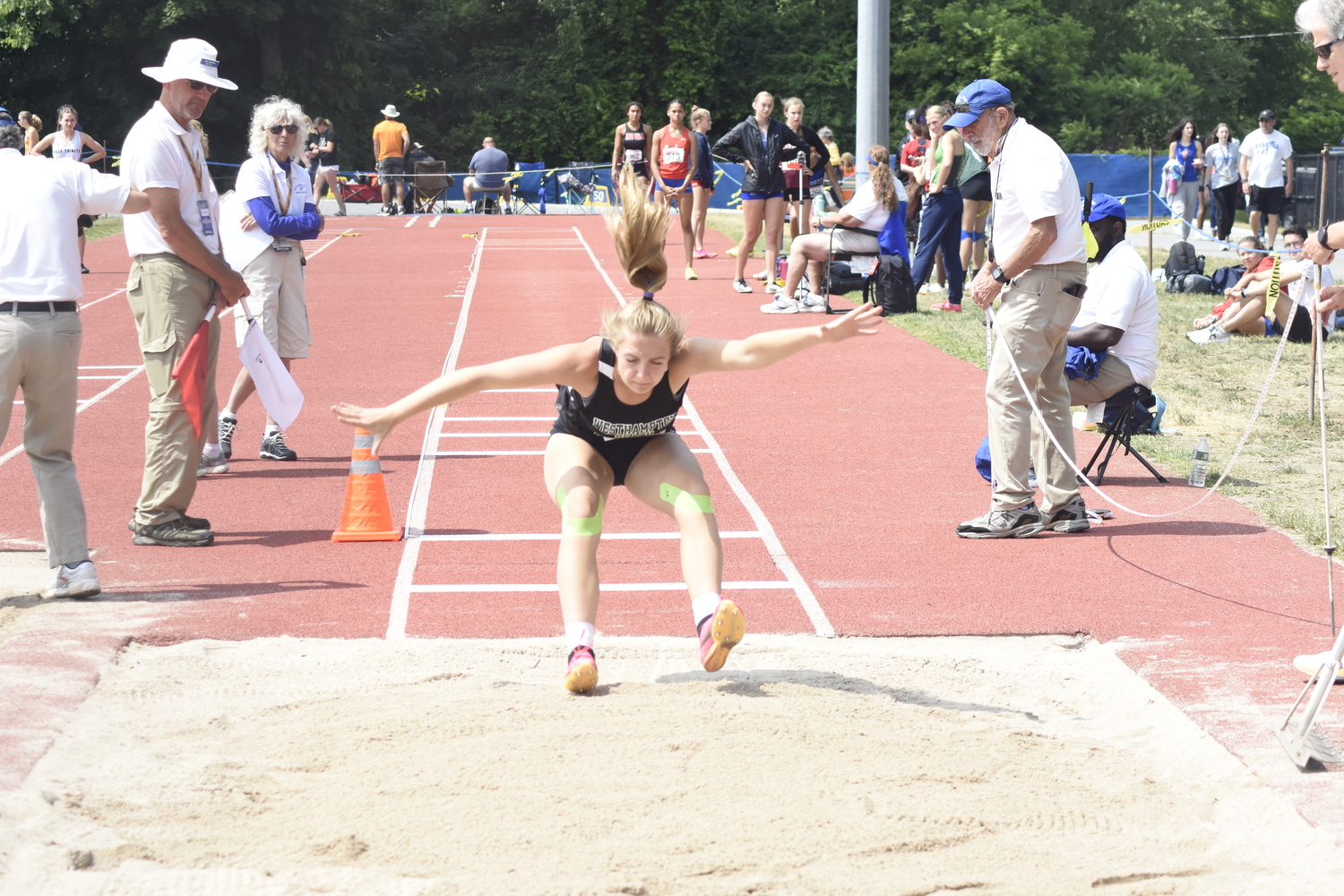 Westhampton Beach junior Maddie Phillips in the long jump of the pentathlon.   DREW BUDD