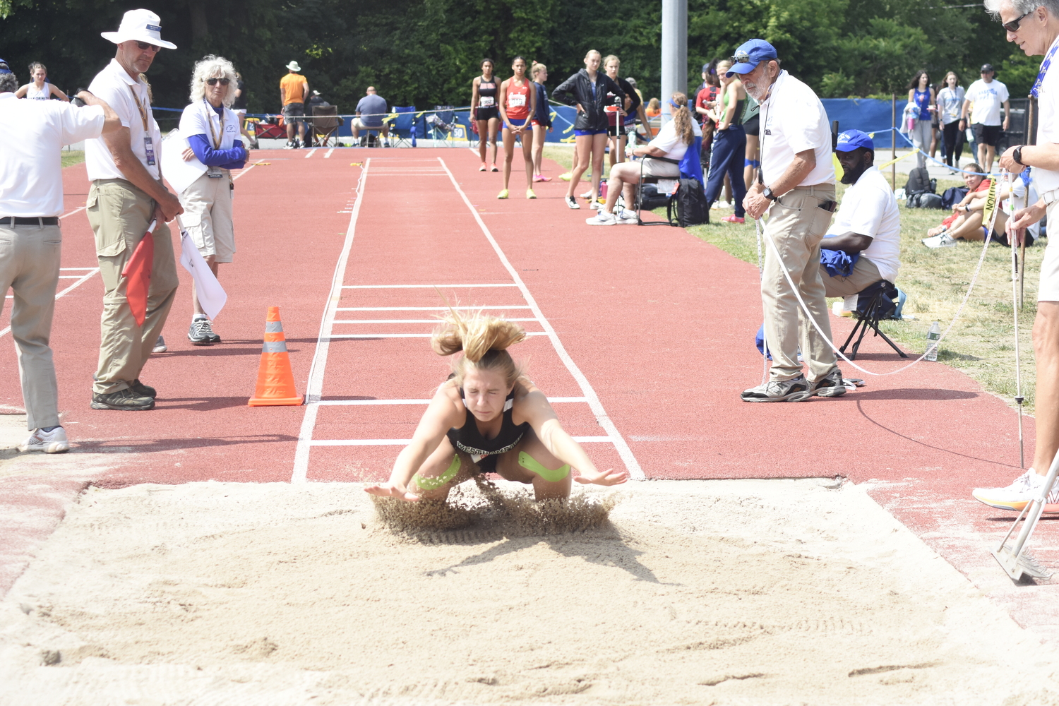 Maddie Phillips makes her mark in the long jump.   DREW BUDD