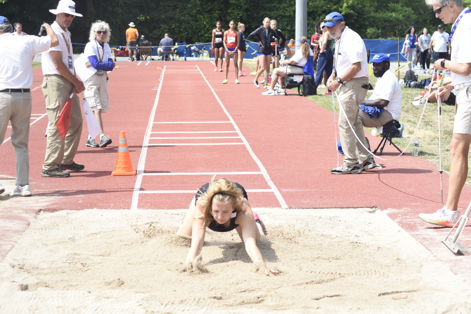 Maddie Phillips makes her mark in the long jump.   DREW BUDD