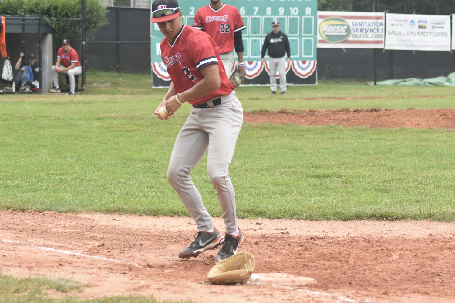 Westhampton first baseman Luke Mistone (Cal State Fullerton) loses his glove after fielding a ground ball close to the foul line, but he grabs the ball and steps on first base for the out.   DREW BUDD