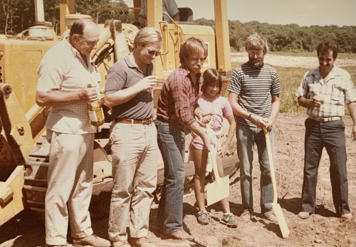 The groundbreaking at Bridgehampton Winery in 1982. From let, retired potato farmer Connie Kalish, architect Bill White, owner Lyle Greenfield and his daughter, Ken Conrad, who also planted a South Fork vineyard, and builder Jay Andriossi. COURTESY LYLE GREENFIELD