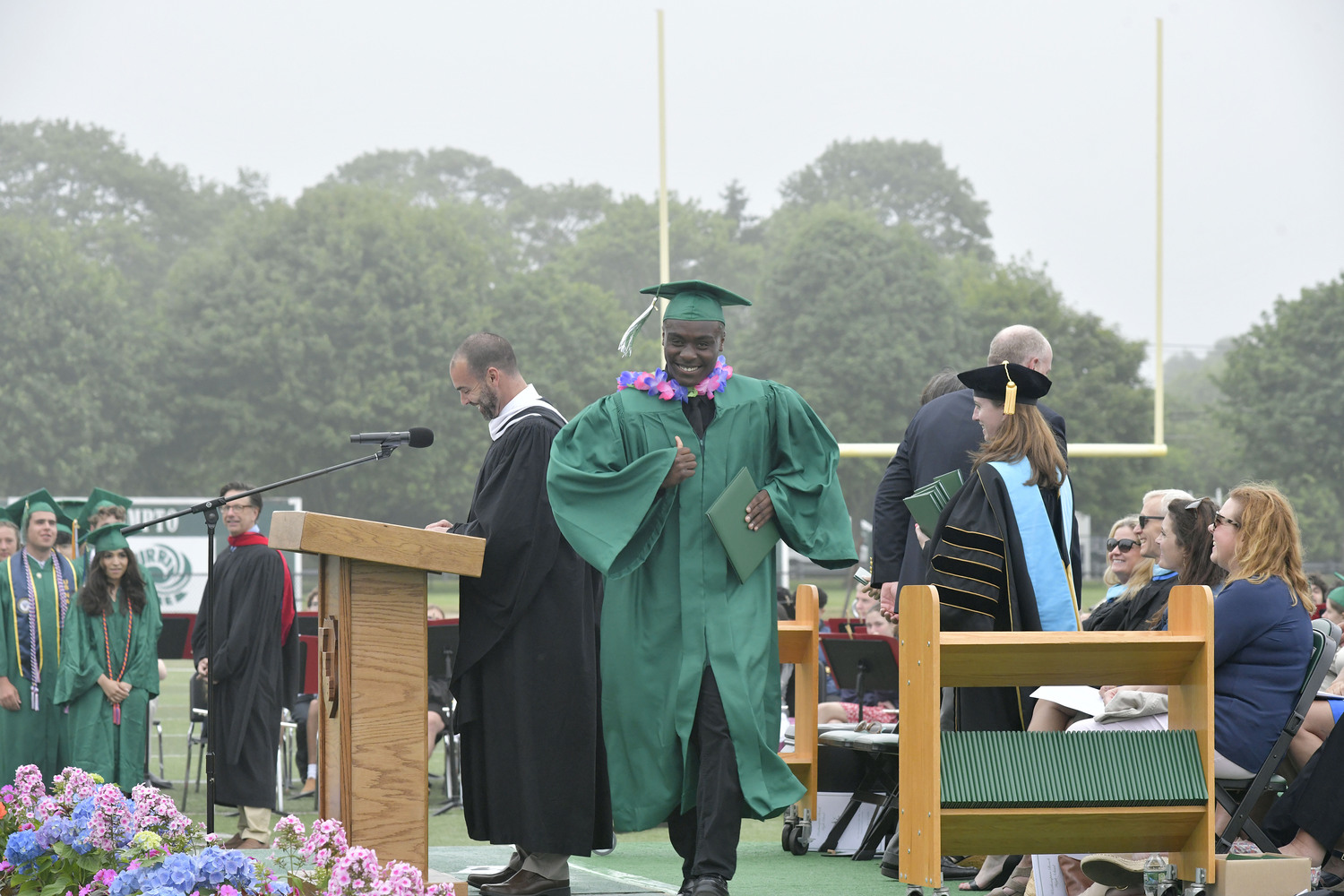 Alexander Joseph Markland O'Henry receives his diploma at Westhampton Beach High School on Friday evening.  DANA SHAW