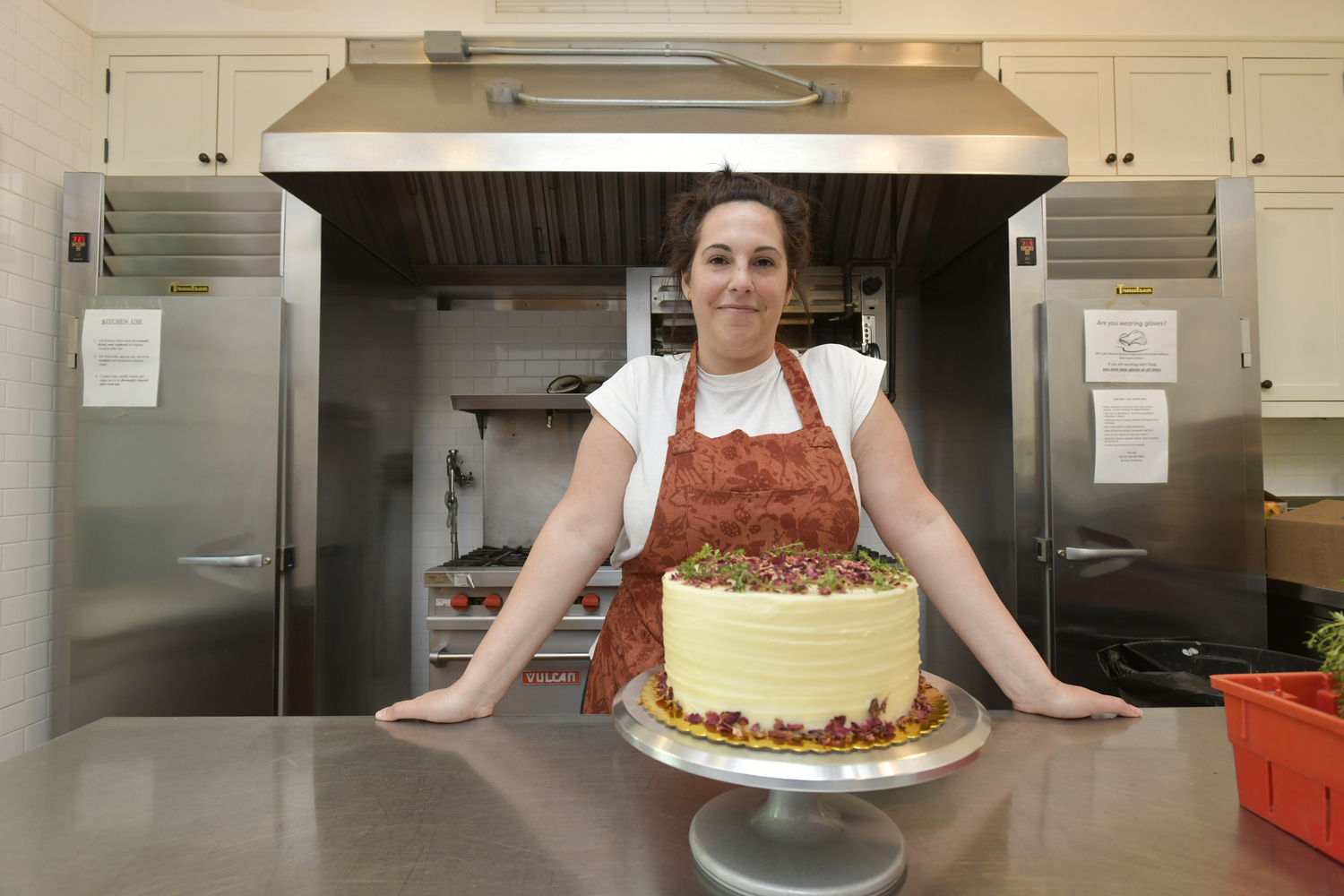 Jamie Pancella at work on a cake in the kitchen of St. Luke's Episcopal Church in East Hampton.   DANA SHAW