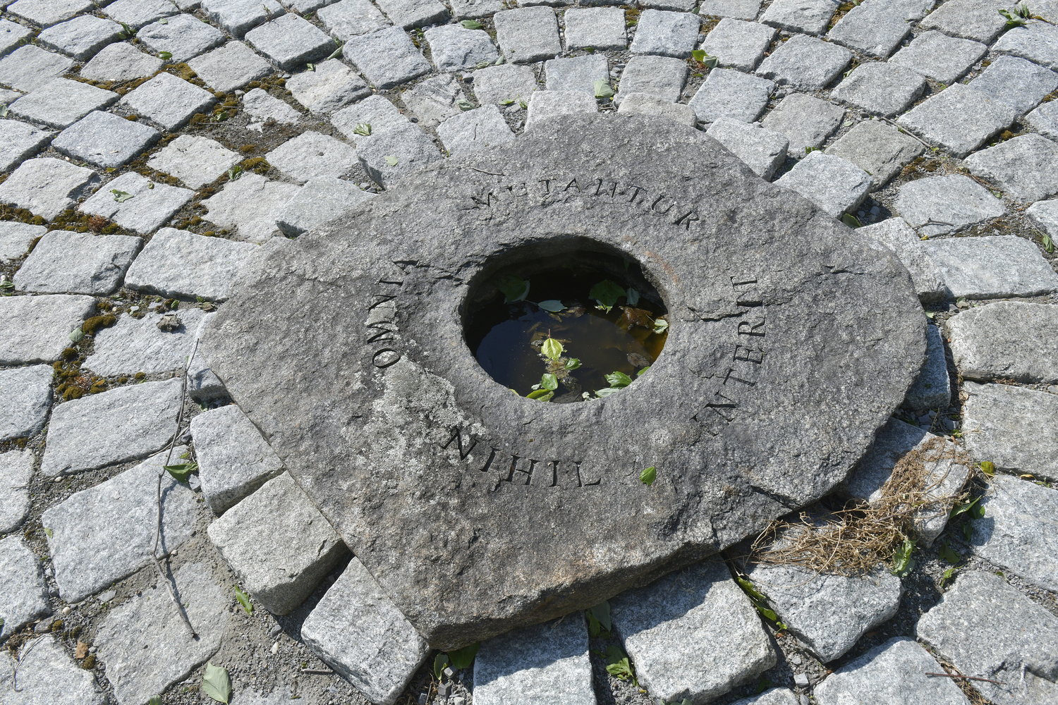 During the summer solstice on June 21, the sun’s shadow will line up with the middle column of the cenotaph, inscribed “Summer / Life / Toil / Sunset” and striking the center well headstone.    DANA SHAW