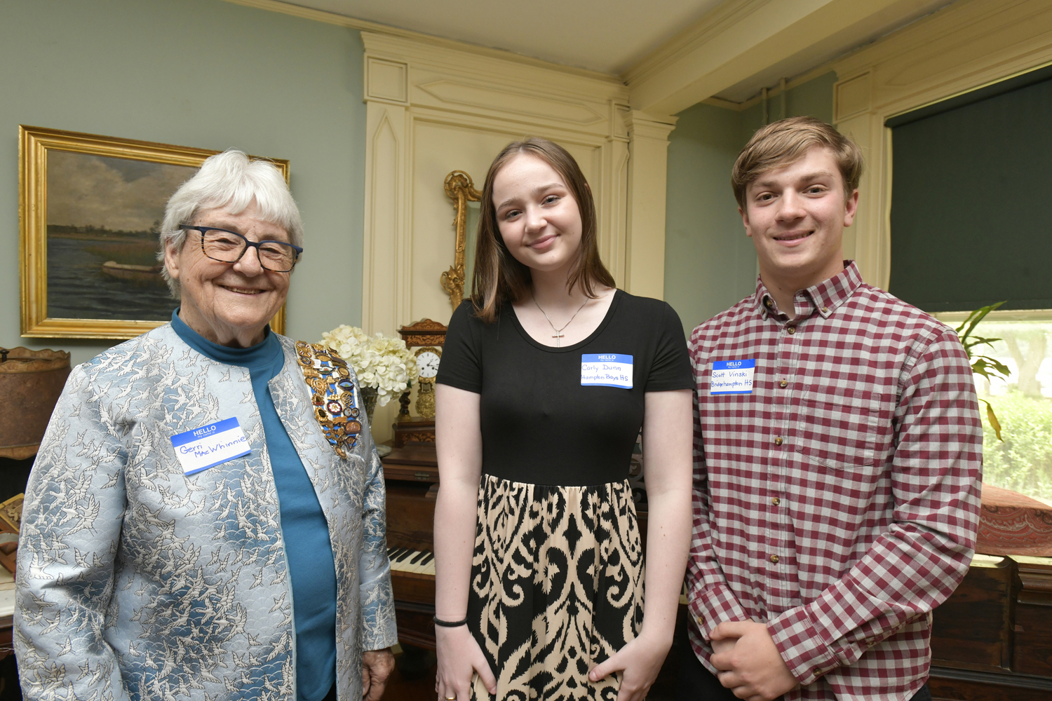 Gerri MacWhinnie of the Southampton Colony Chapter of the Daughters of the American Revolution (DAR) with DAR Scholarship recipients Carly Dunn of Hampton Bays High School and Scott Vinski of Bridgehampton High School. Recipients not pictures, Sadie Radice from Southampton High School and Emily Squires from Pierson.  DANA SHAW