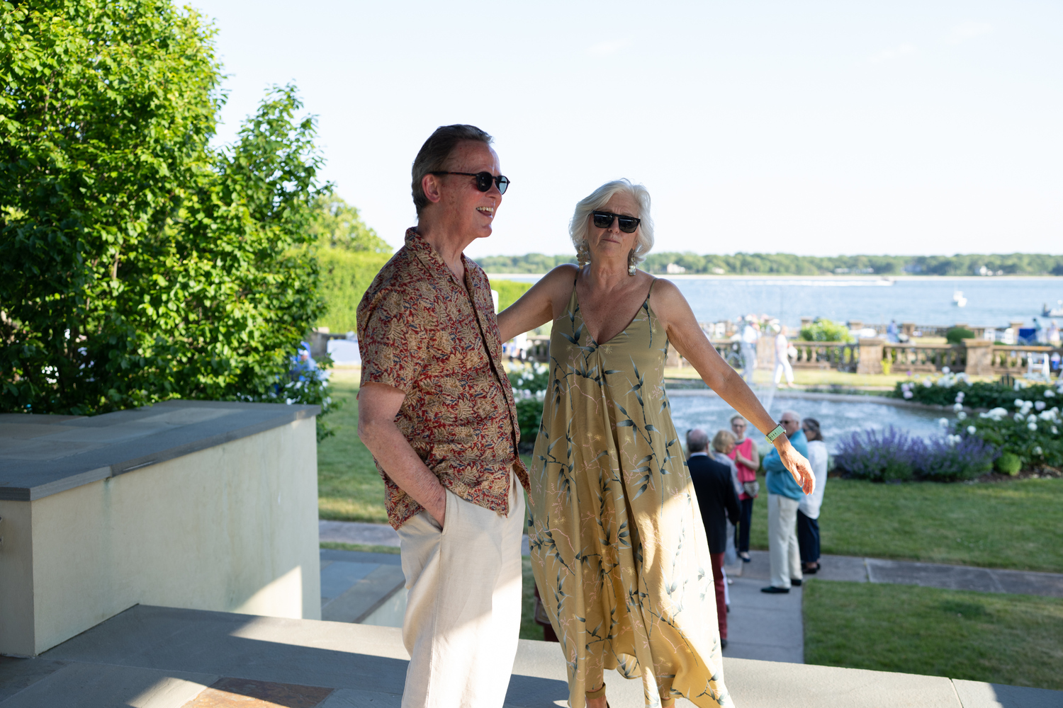 Fighting Chance, a cancer support organization with offices in Sag Harbor and Southampton, held its annual summer benefit on Saturday, June 10, in the Artemas Ward's Italian Gardens at the home of Rich Hogan on Shelter Island. Frazer Pennebaker and Fighting Chance Executive Director Kathleen Mulcahy welcome people to the Gardens at Wards Point. COURTESY FIGHTING CHANCE