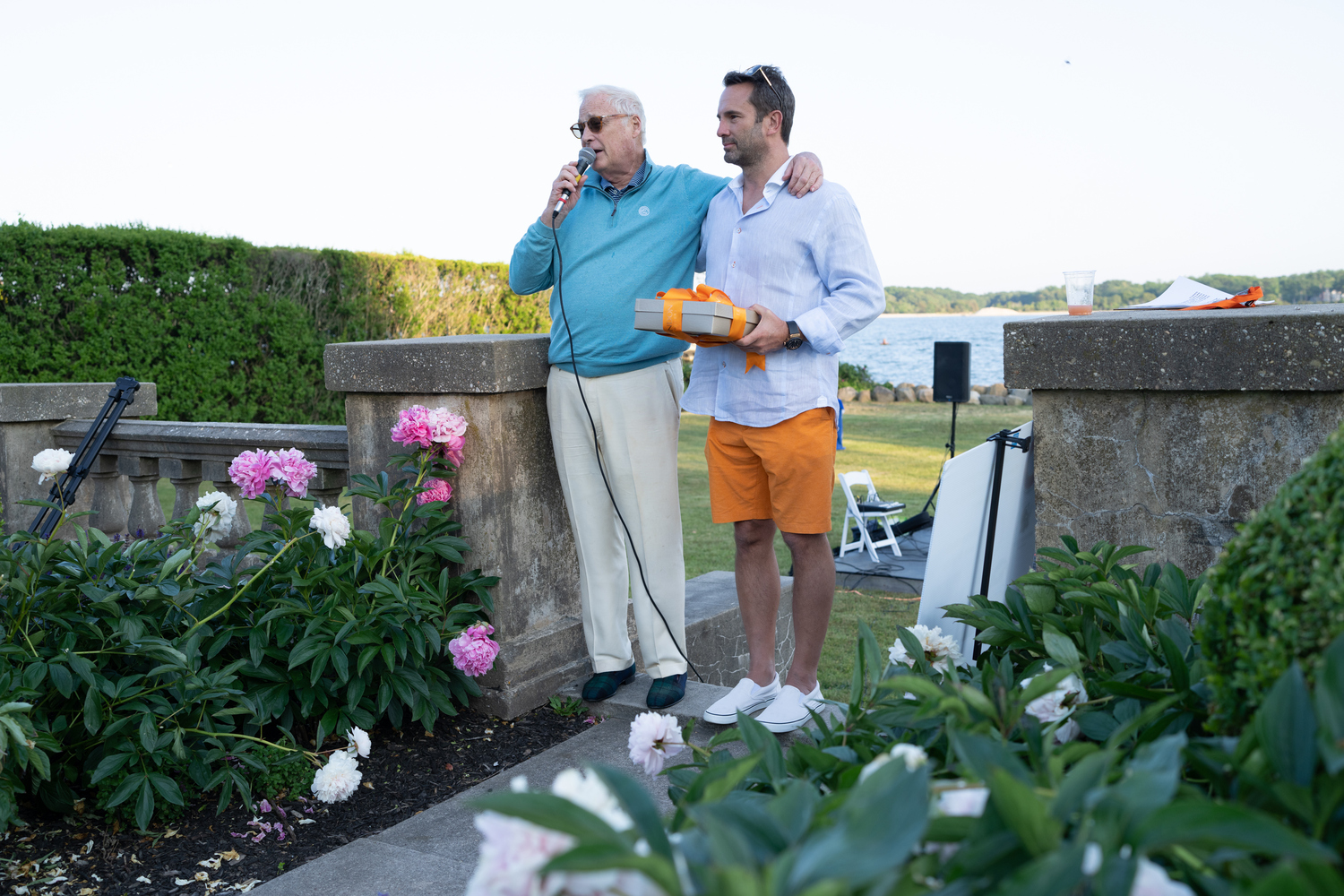 Fighting Chance, a cancer support organization with offices in Sag Harbor and Southampton, held its annual summer benefit on Saturday, June 10, in the Artemas Ward's Italian Gardens at the home of Rich Hogan on Shelter Island. During the event, Fighting Chance founder Duncan Darrows presented Joe Ialacci, president of Yacht Hampton and a Fighting Chance board member, with the Fighting Chance Medal of Honor.  COURTESY FIGHTING CHANCE