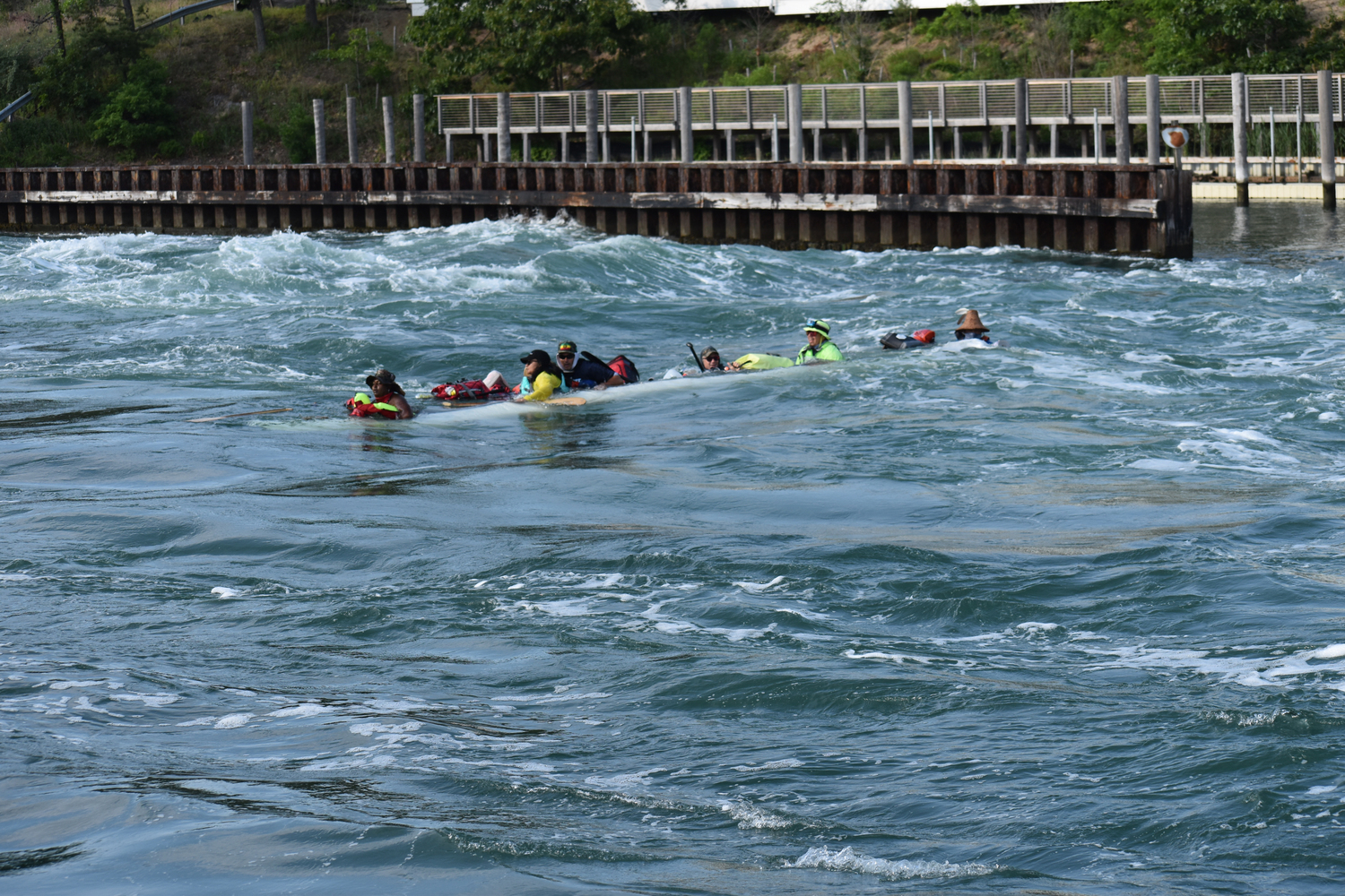 Six people on a multiday canoe journey from Boston to New York City were passing through the Shinnecock Canal on Friday when a motorboat going the opposite direction began zig-zagging, creating a wake that swamped the canoe.    STEPHEN J. KOTZ