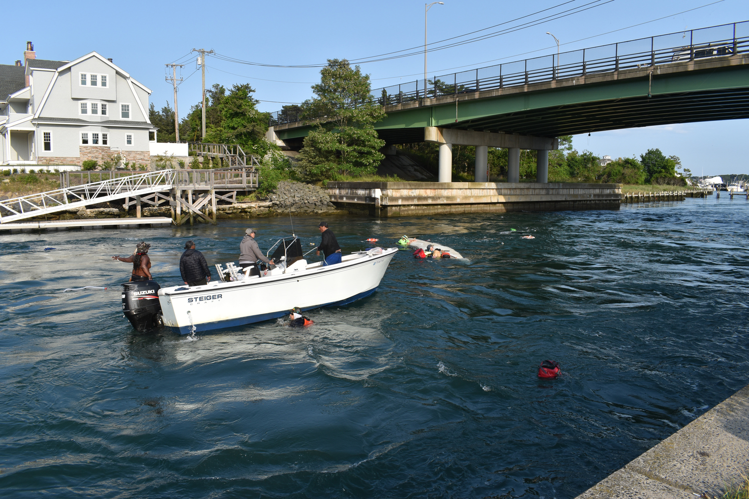 Six people on a multiday canoe journey from Boston to New York City were passing through the Shinnecock Canal on Friday when a motorboat going the opposite direction began zig-zagging, creating a wake that swamped the canoe.    STEPHEN J. KOTZ