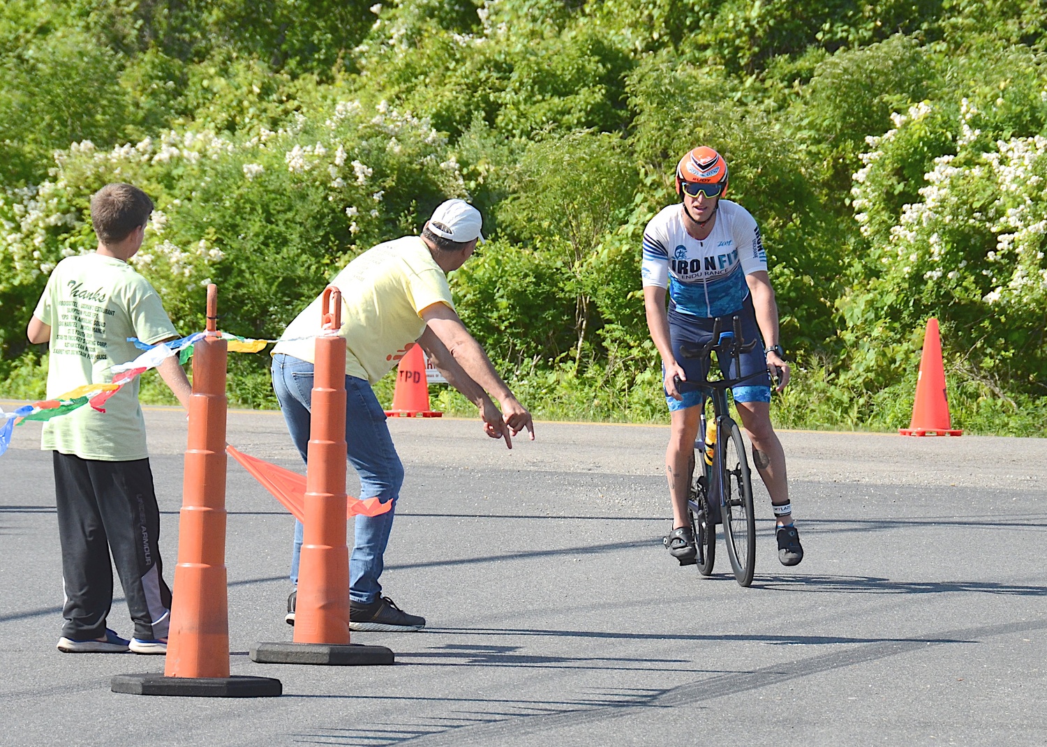 Triathletes make the transition from the bike to the run portion.   KYRIL BROMLEY
